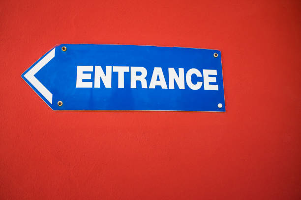 Close up entrance sign painted on building wall
