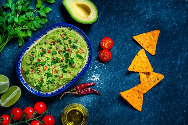 istock Guacamole and chips on bluish tint table 1245075026