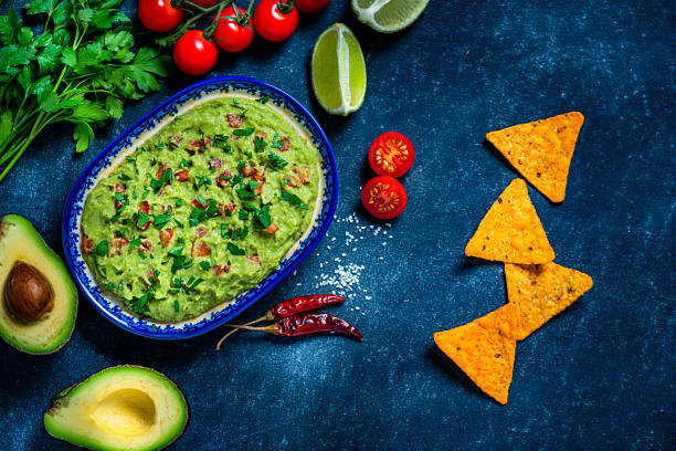 istock Guacamole and chips on bluish tint table 1245075042