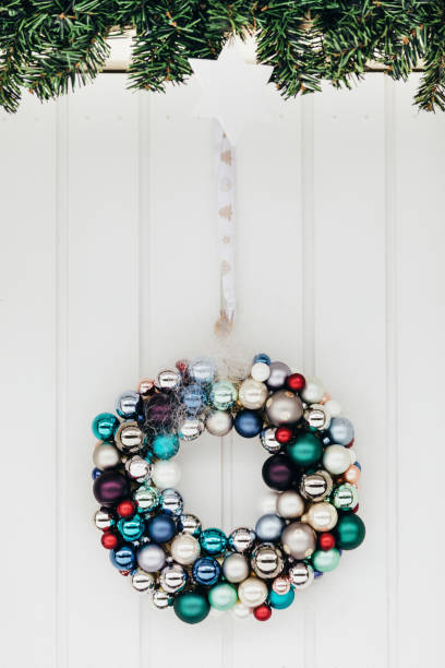 istock Festive door wreath made with christmas tree balls. 1245075262