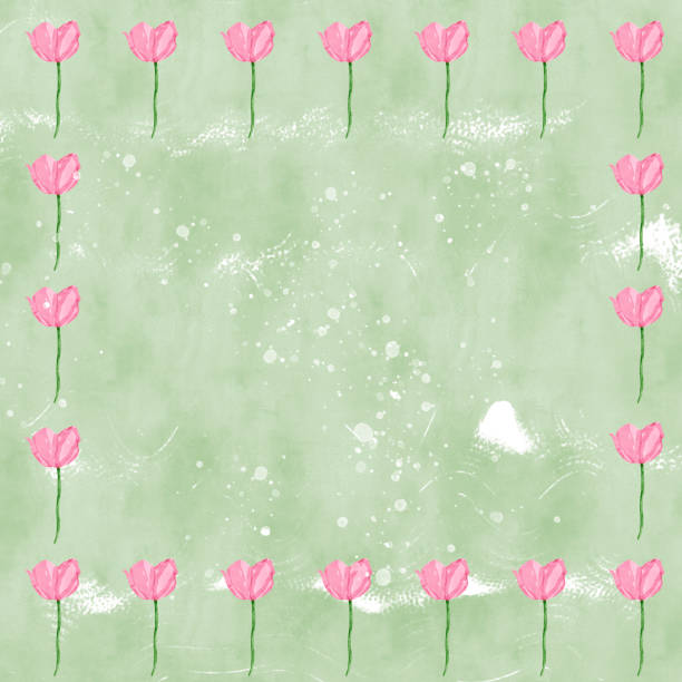 istock Little pale pink tulips as border or frame on light green background with splatter and copy space 1245078055