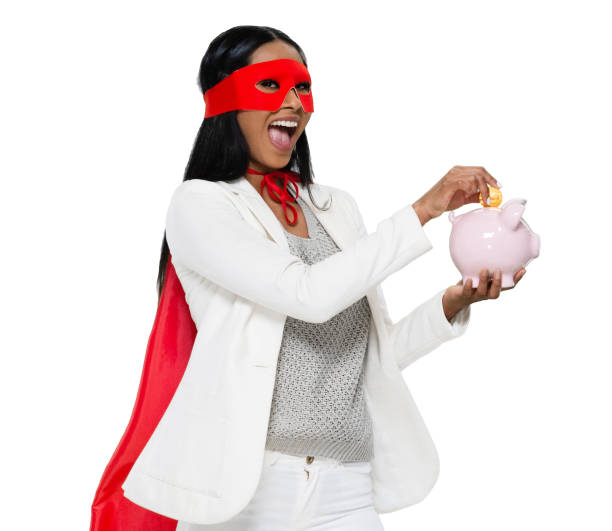 etnia latino-americana e hispânica jovens mulheres heroínas em pé usando máscara - disfarce e segurando moeda - superhero currency heroes savings - fotografias e filmes do acervo