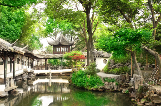 Ancient pavilion in Humble Administrator's Garden in Suzhou, China Ancient pavilion and pond in Humble Administrator's Garden in Suzhou, China. Summer day suzhou stock pictures, royalty-free photos & images