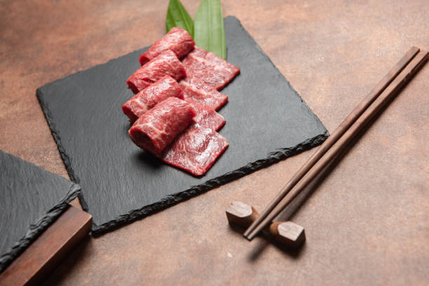 Fresh raw beef brisket slice set on the black marble dish rock. Fresh raw beef brisket slice set on the black marble dish rock. healthy and raw food concept boneless chuck steak stock pictures, royalty-free photos & images