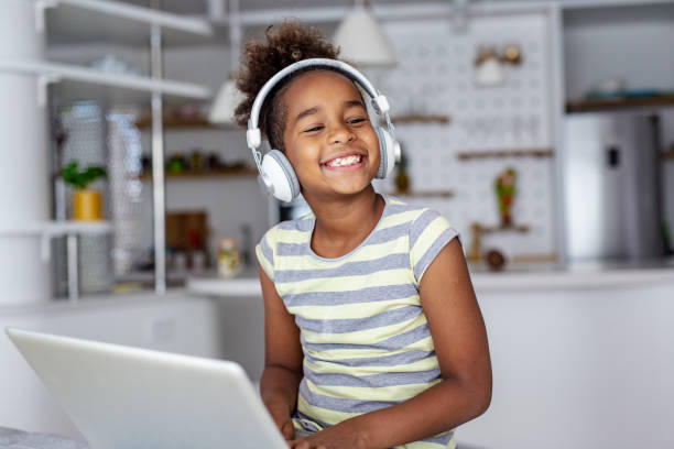 istock Young girl at home using laptop 1245124481