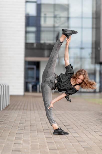 istock Dancer with black face mask outdoors 1245141608