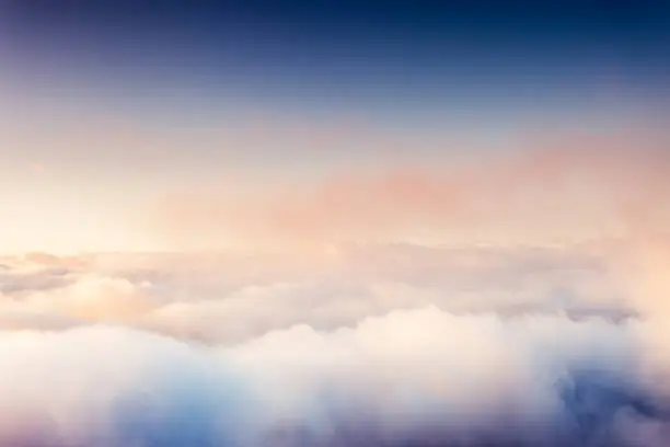 Photo of Fog and clouds on a blue sky.