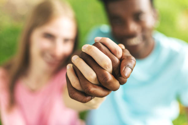 istock Multi Ethnic Heterosexual Generation Z Couple Holding Hands 1245151474