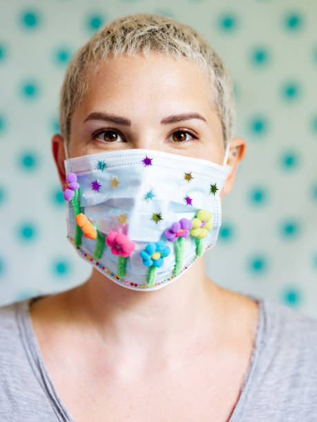 istock Young woman with artsy face mask 1245160634