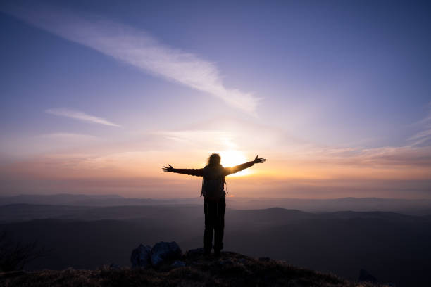 istock Woman standing on mountain 1245161979