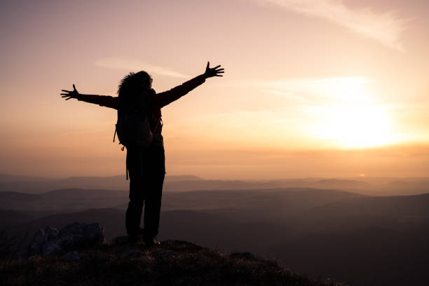 istock Woman standing on mountain 1245161994