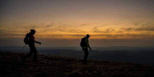 istock Hikers hiking together on mountain 1245162310