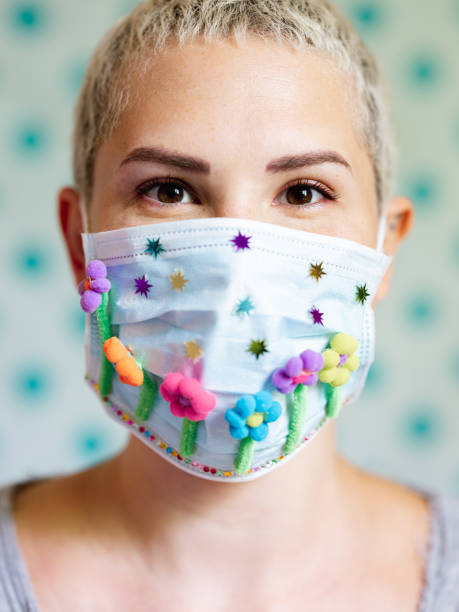 istock Young woman with artsy face mask 1245163641
