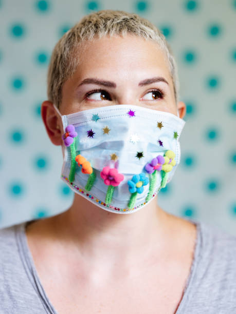 istock Young woman with artsy face mask 1245166337