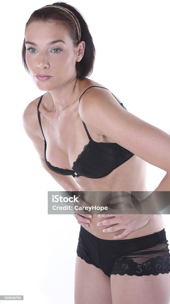 woman with cramps woman in bra and underwear leaning over in pain Adult Stock Photo