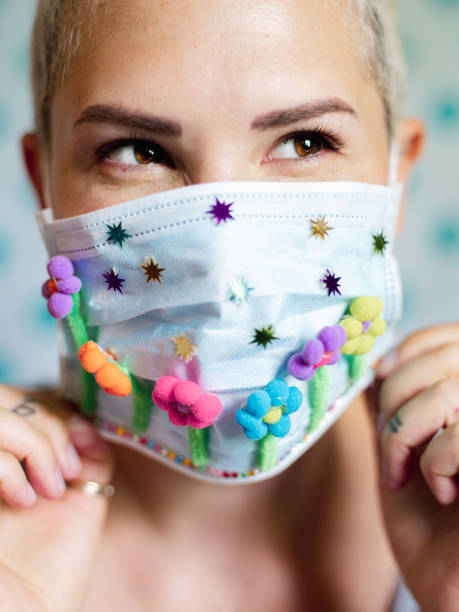 Young woman with artsy face mask