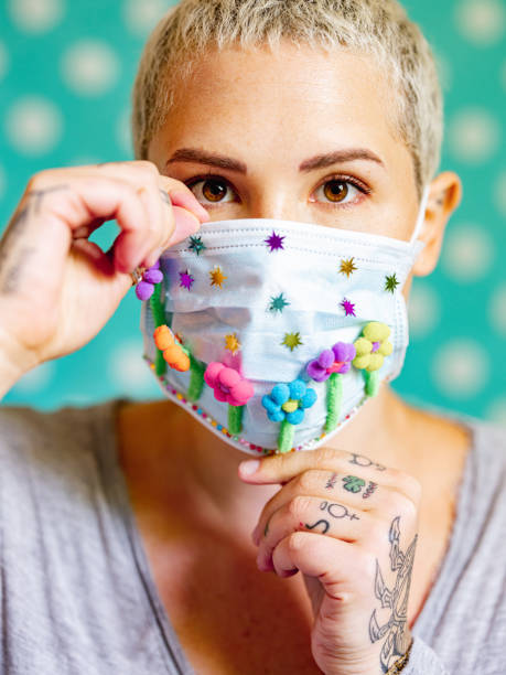 istock Young woman with artsy face mask 1245168534