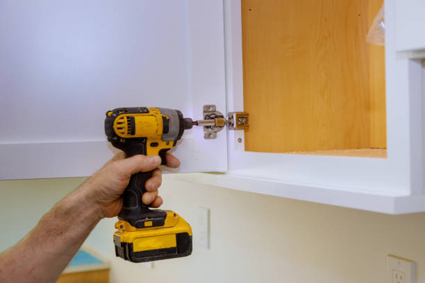 istock Modern fixing cabinet door hinge adjustment on kitchen cabinets 1245178898