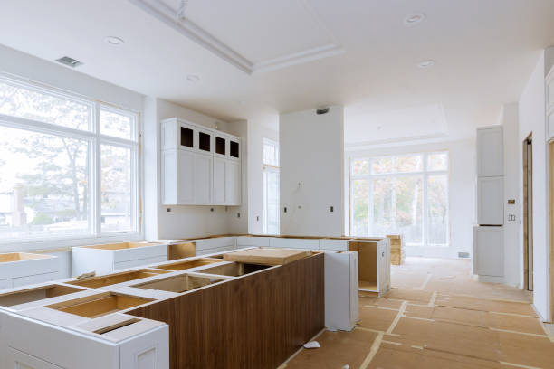 istock Installation of worker installs to kitchen cabinet. 1245178905