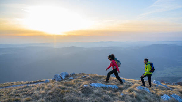 istock Hikers hiking together on mountain 1245181878