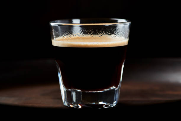 istock Coffee in glass cup on dark background. Close up. 1245183918