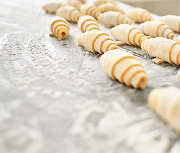 Shot of croissant rolls on the kitchen counter at bakery