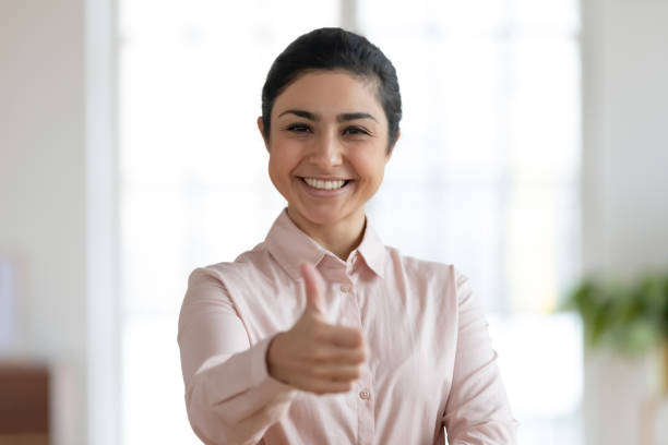 istock Young indian woman showing thumbs up gesture 1245196329
