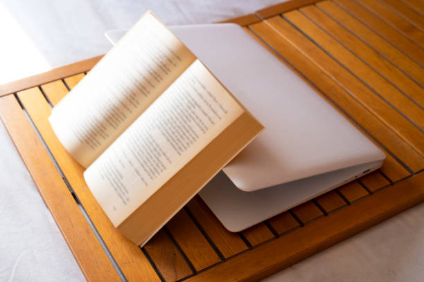 istock Book on top of a computer. Digital detox. 1245196913