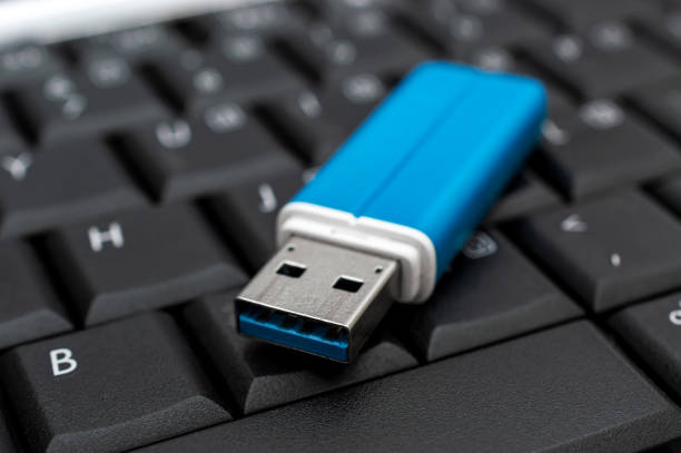istock Flash drive on the laptop keyboard. 1245213183