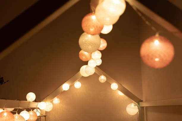 istock Light garland on canopy bed in montessori room 1245228520
