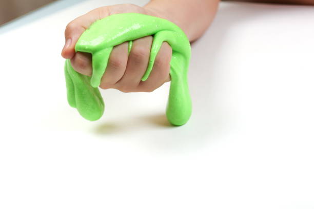 istock child's hands are playing with a slime 1245234793
