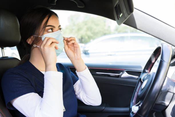 istock Female doctor adjusts protective mask 1245240501