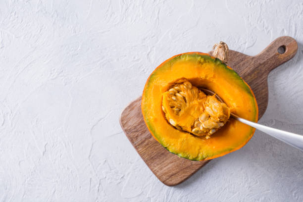 istock Fresh half pumpkin, cooking. Healthy food. Copy space 1245277516