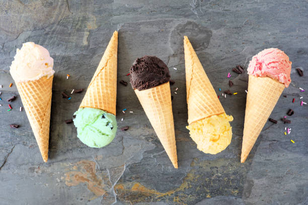 istock Assorted ice cream cones flat lay over a dark slate background 1245279700