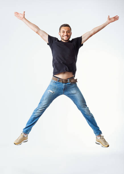 istock Happy excited man jumping 1245284649