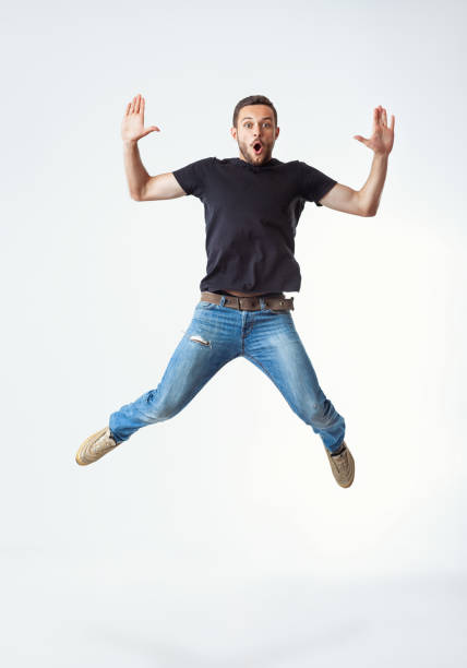 istock Happy excited man jumping 1245284655