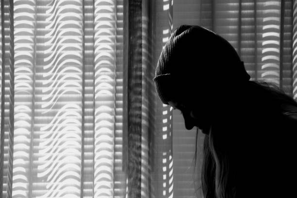 istock Young woman black and white silhouette 1245289343