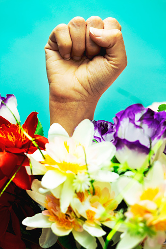 Hand symbol protest in USA to stop violence to black people with flowers. Fight for human right of Black People in U.S. America.
