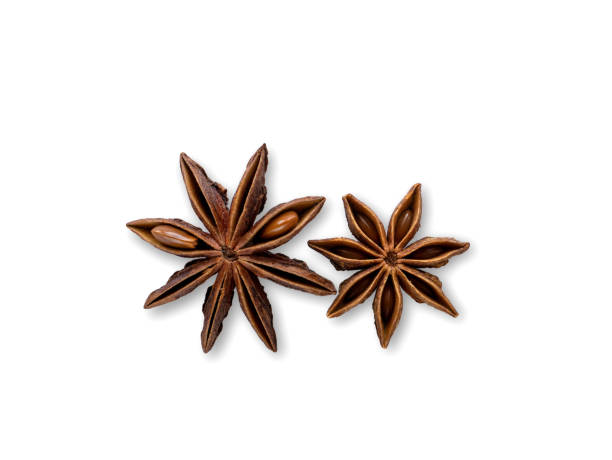 istock Two anise stars on a white isolated background. Close-up, top view 1245329031