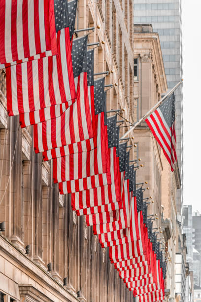 istock American Flags Against Office Building 1245371222