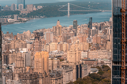 Top view of buildings in the Upper West Side of Manhattan, below you can see Central Park, the Hudson River and the George Washington Bridge in the background.