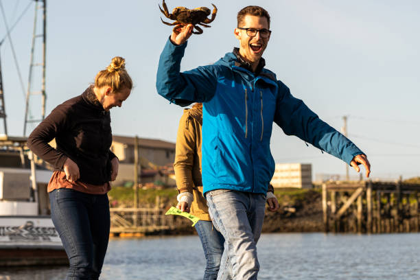 istock Friends celebrate the crab they caught 1245373341
