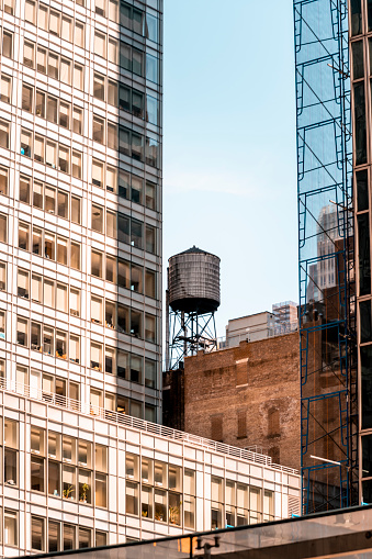 Rooftop water tower in Manhattan, New York City. This structure supplies water pressure to floors at higher elevation than public water towers.