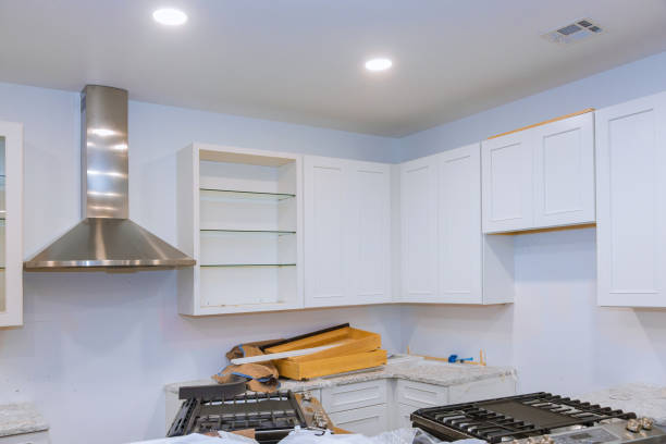 istock Installing new kitchen hood in modern installation of cabinet 1245386617