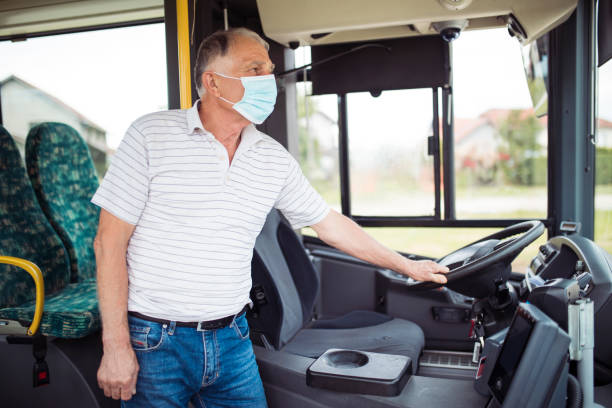 Senior man bus driver wearing mask
