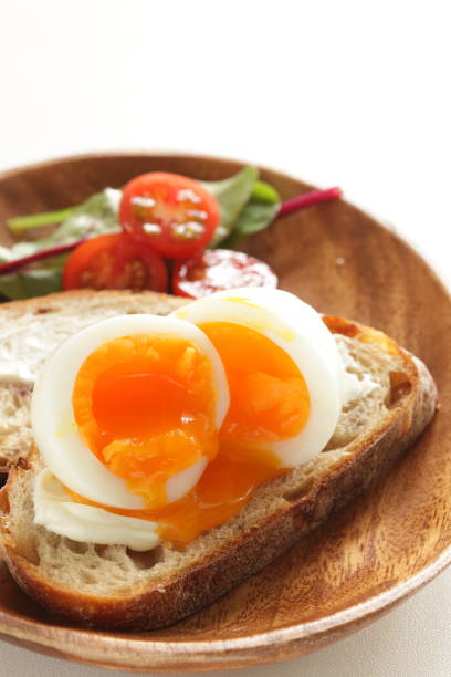 istock soft boiled egg on cream cheese toast for gourmet comfort breakfast 1245393968