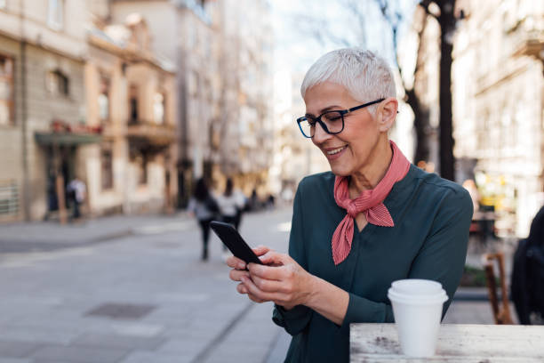 istock Elderly woman using a smart phone 1245423399
