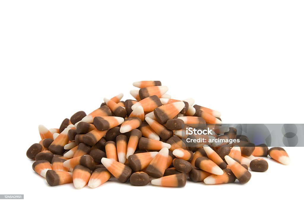 pile of dark candy corn on white background  Autumn Stock Photo