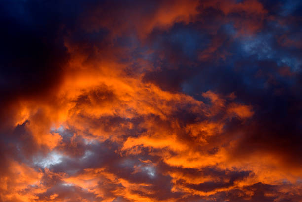 Dramatic Sunrise Sky Dramatic clouds are illuminated by the rising sun. storm cloud sky dramatic sky cloud stock pictures, royalty-free photos & images