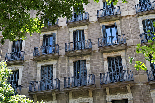 Details of the one of old residential buildings in the historical center of Barcelona in sunny day. Spain.
